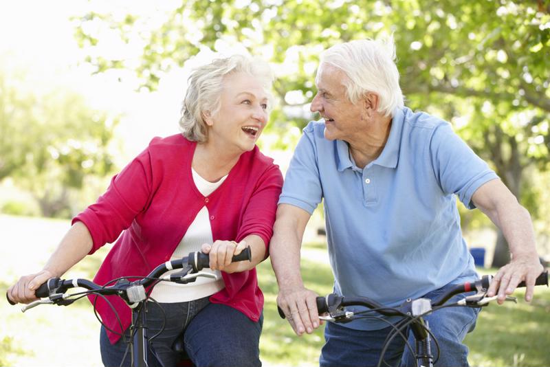 Elderly couple on bikes