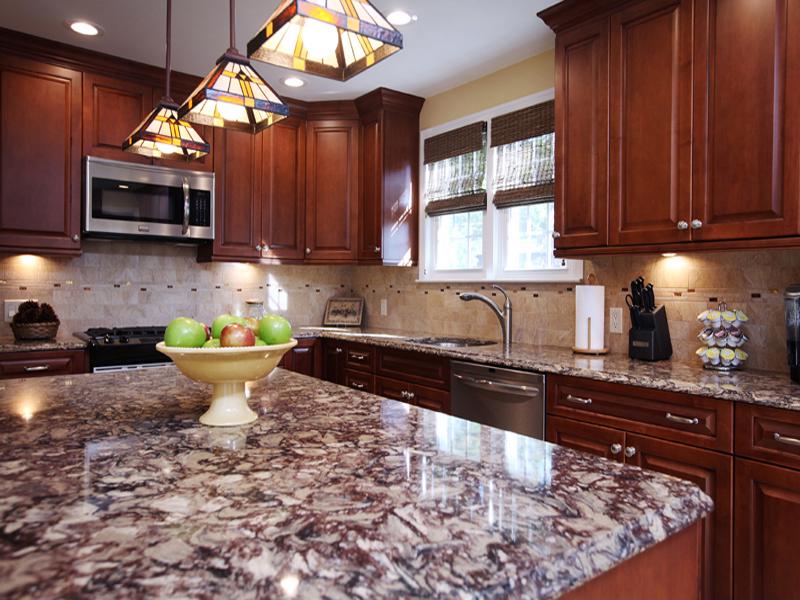 These granite countertops perfectly complement this kitchen remodel. 
