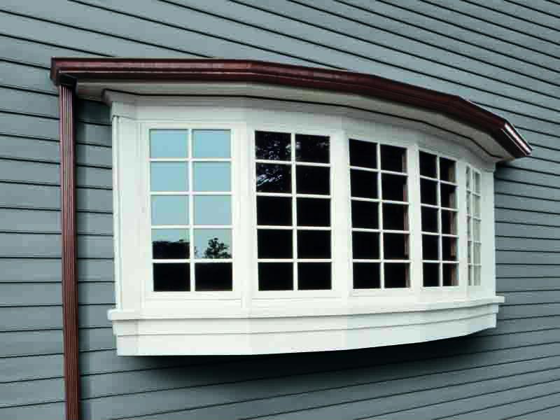 This bow window is a beautiful example of how the right window can improve your home's exterior.