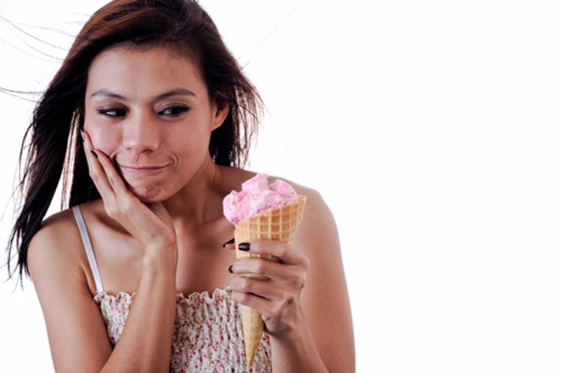 Teenager with ice cream cone.