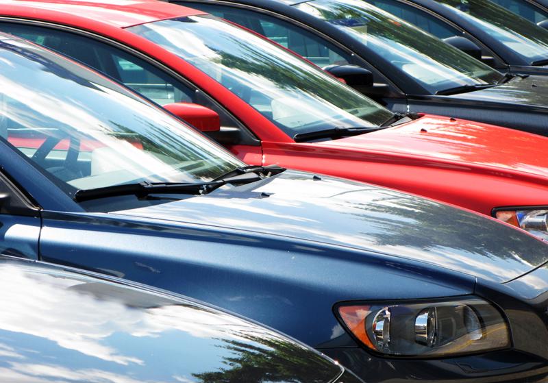 Cars on an auto dealer's lot.