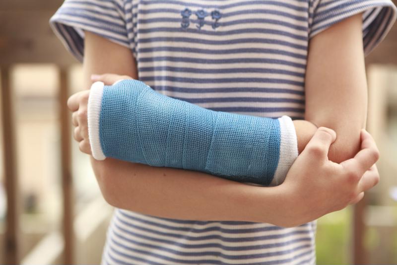 Little girl with arm in cast.