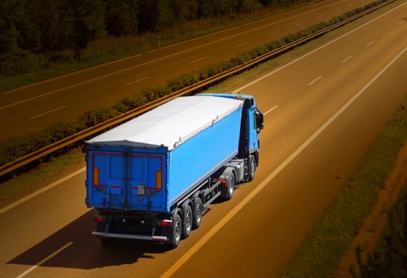 A truck driving down a highway