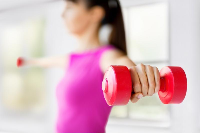 Girl lifting weights.