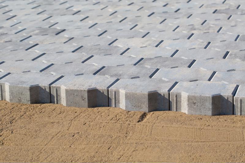 Make sure you have the appropriate depth of sand bedding underneath your pavers. 