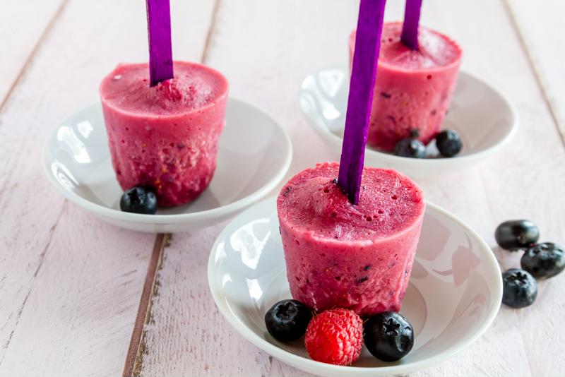 Serve these frozen fruit pops with your favorite berries.