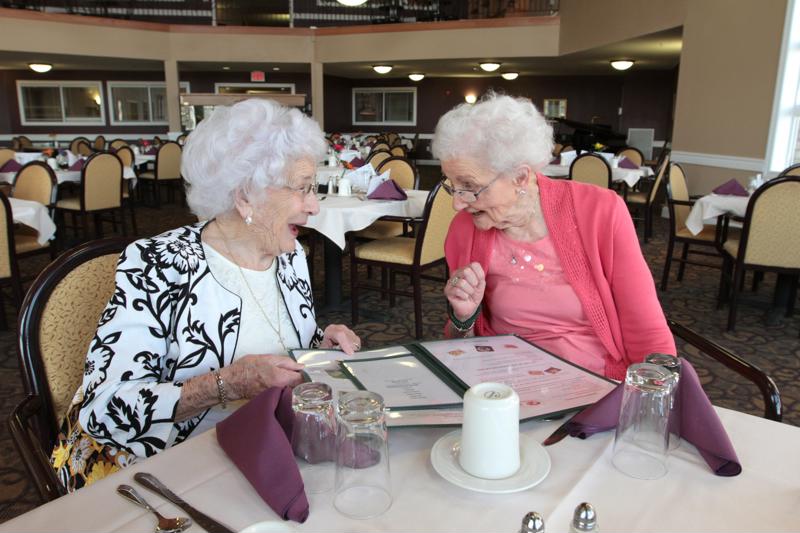Seniors can eat with their friends in the community dining room.