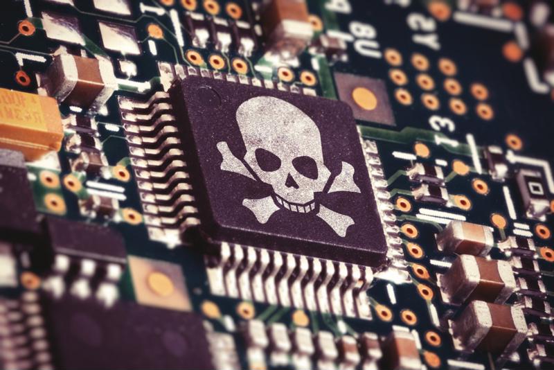 skull and crossbones imprinted on microchip (concept art of cybersecurity flaw)