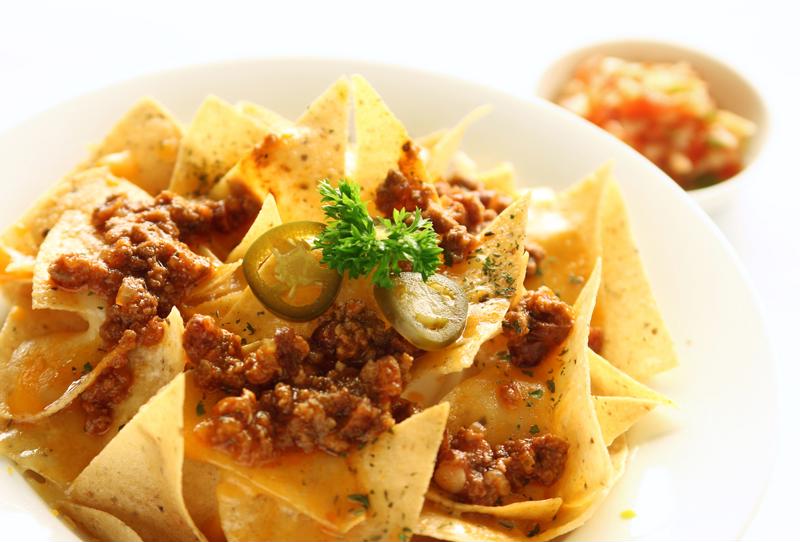 Spicy beef chili goes perfectly with tortilla chips.