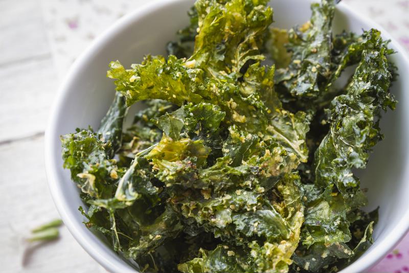 Kale chips make a delicious, low-calorie alternative.