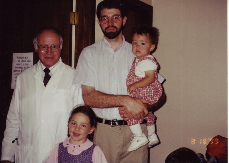 Dr. Donaldson with his two young children and father in 1999.
