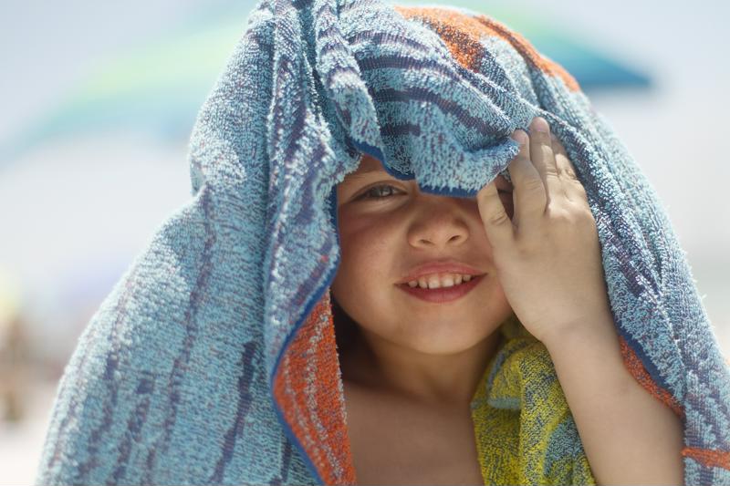 Colorful elements add a fun visual touch to your baby beach photos.