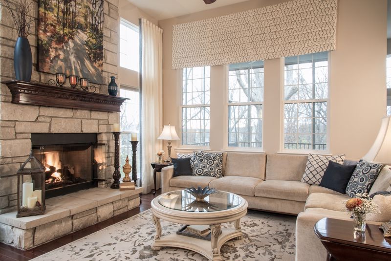 living room with fireplace and tan couch