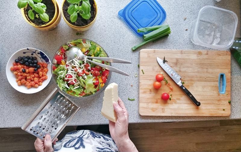 woman making a salad