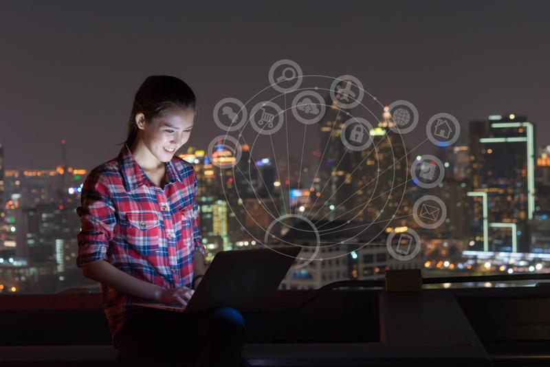 A woman uses a laptop with internet connectivity.