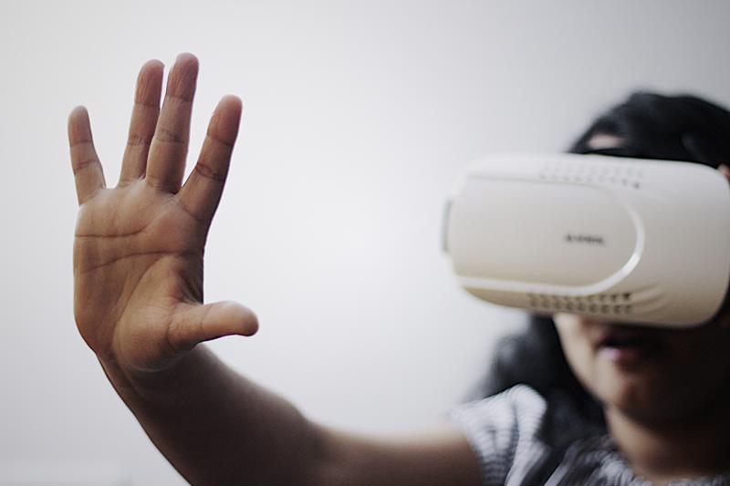 A woman wearing a VR headset.