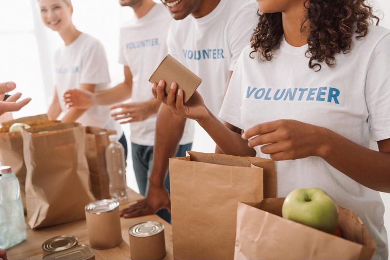 Female volunteer organizing food donations