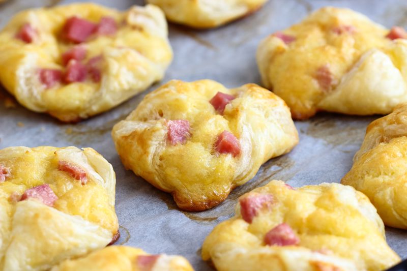 A tray of ham and cheese puff pastries