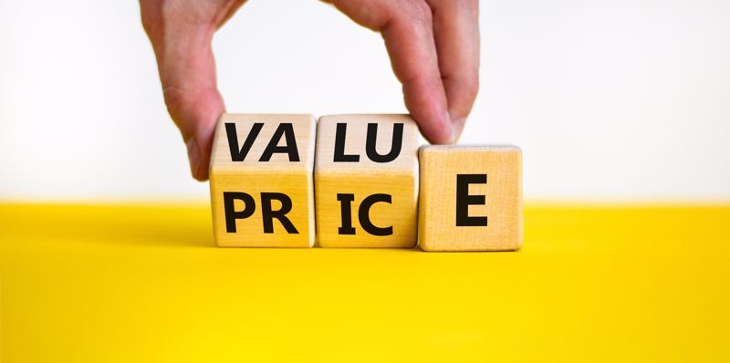 Wood blocks spelling "value" and "price"