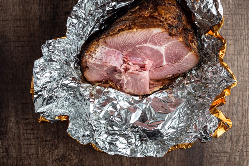 Leftover ham sits in aluminum foil
