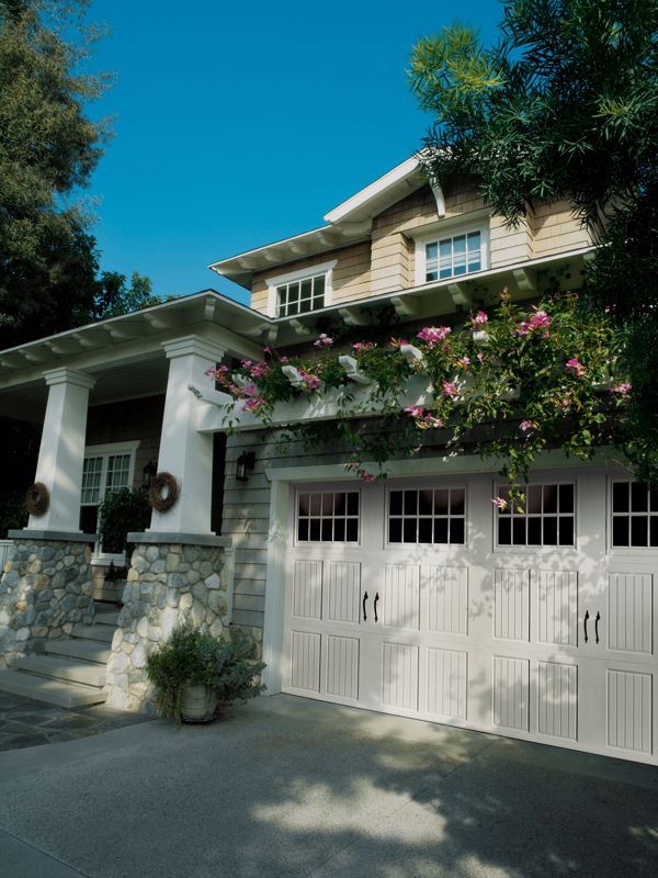 Magnetic hardware is an easy way to enhance the look of a carriage house garage door, adding to its historical charm.